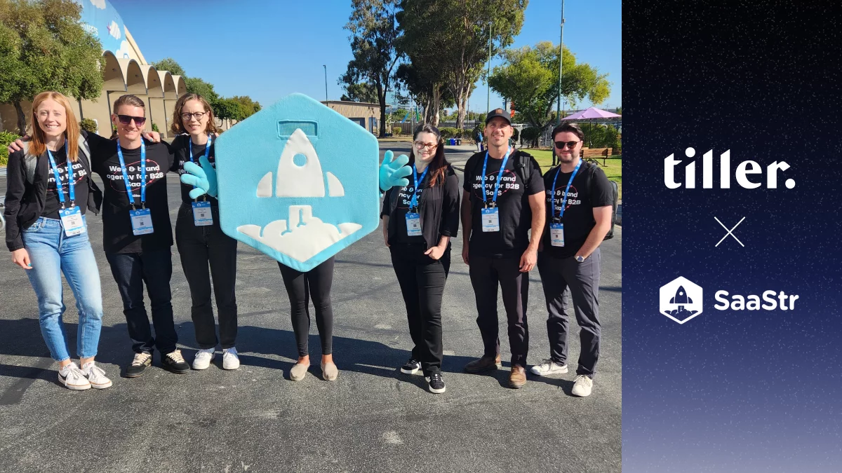 Six members of the Tiller team standing with the SaaStr mascot at SaaStr Annual 2024