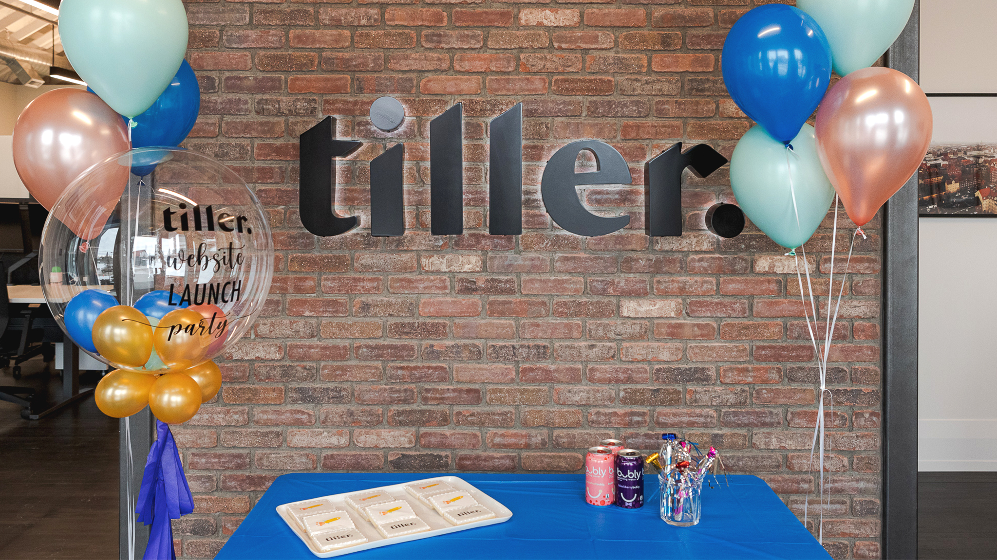 Picture of the Tiller website launch party with custom balloons and cookies.