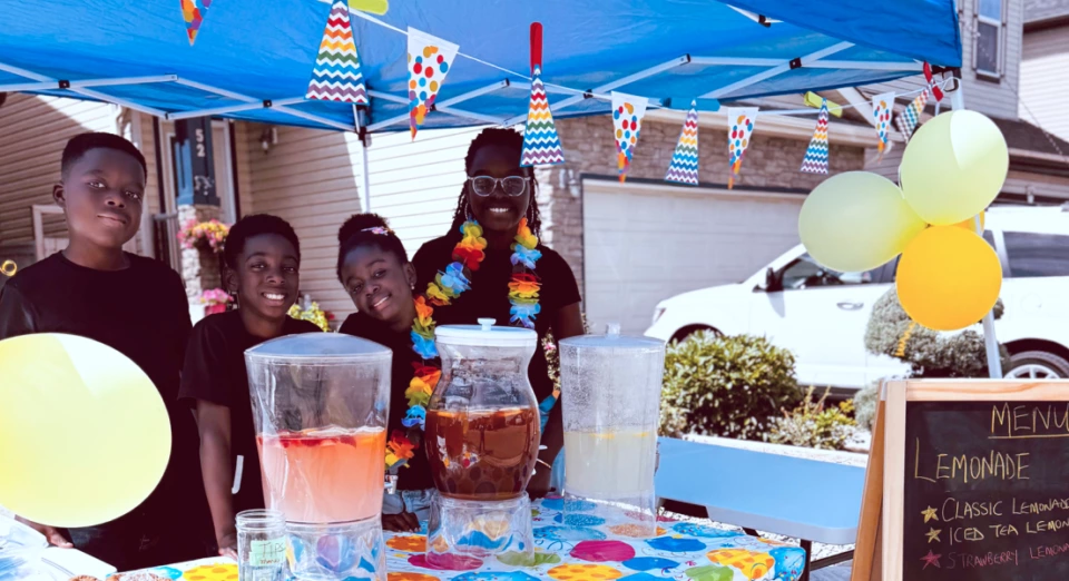 4 kids, owners of The Main Squeeze lemonade stand during Lemonade Day Calgary